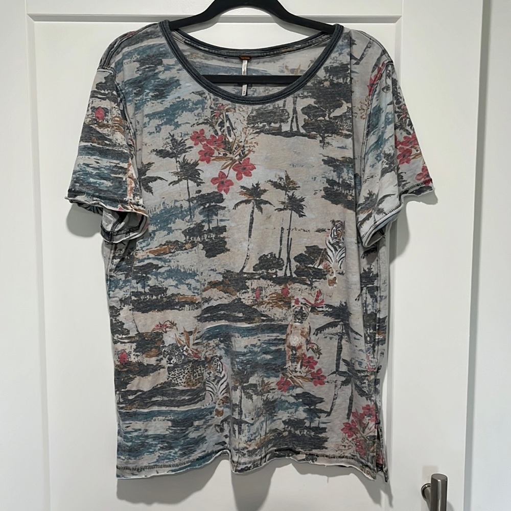 Free people tee.  Distressed looking top.
